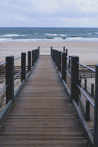 Pier over sea against sky