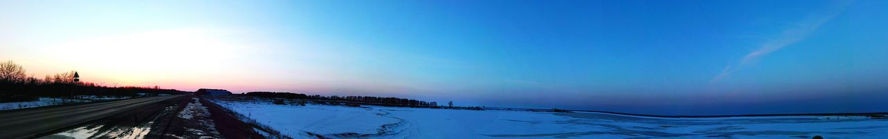 Scenic view of trees against sky during winter