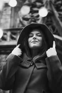 Close up woman in hooded coat in town monochrome portrait picture