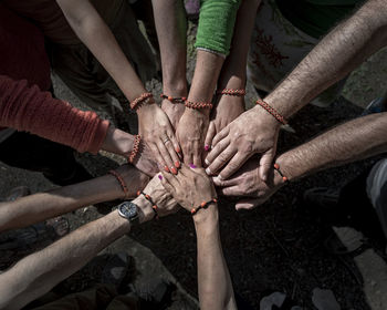 High angle view of people hands