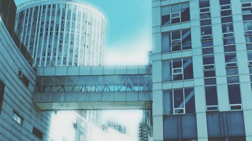 Low angle view of office building against sky