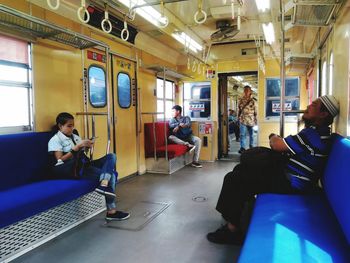 People sitting in subway train