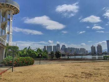 Cityscape against cloudy sky