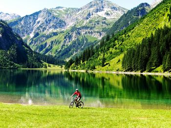 Scenic view of lake with mountains in background