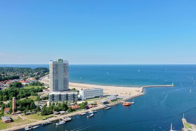 High angle view of swimming pool by sea against clear sky