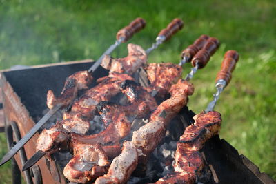 Close-up of meat on barbecue grill