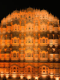 Low angle view of illuminated building at night