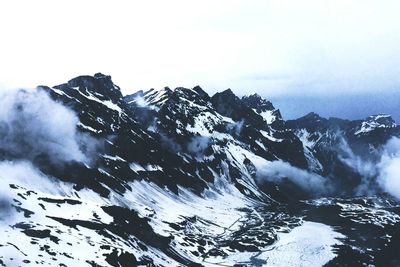 Snowcapped mountains against sky