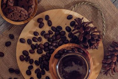 High angle view of coffee beans in glass on table