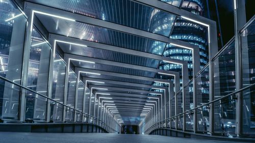 Low angle view of escalator in illuminated building