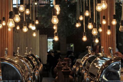 View of illuminated candles in restaurant