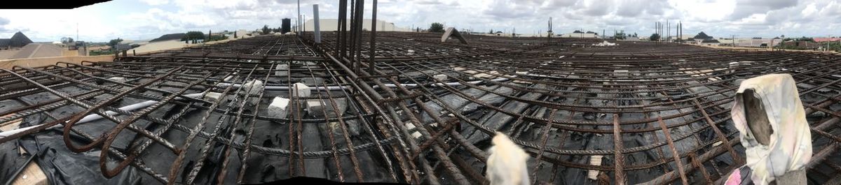 Panoramic view of factory against sky