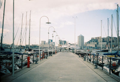 Harbor against sky in city