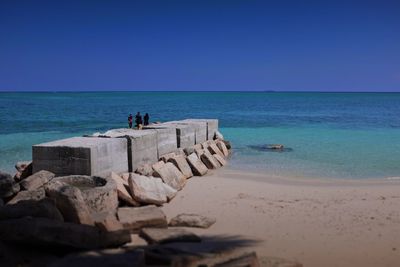 A stack of rock pilled together and used as a pier at pulau mabul