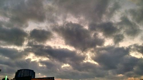Low angle view of cloudy sky at sunset