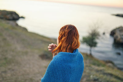 Rear view of woman looking at sea