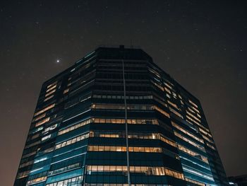 Low angle view of building against sky at night
