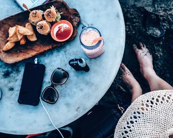 Midsection of man having breakfast on table
