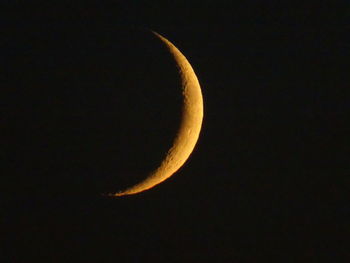 Low angle view of moon against sky at night