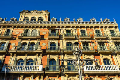 Low angle view of building against clear blue sky