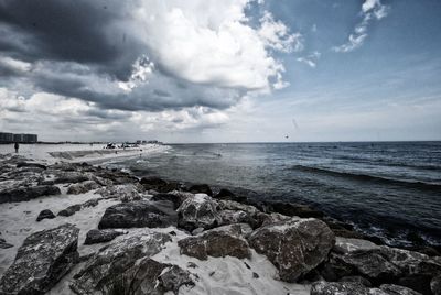 Scenic view of sea against cloudy sky