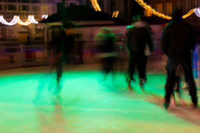 Blurred motion of people at night