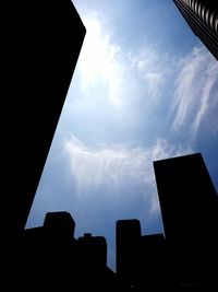 Low angle view of building against cloudy sky