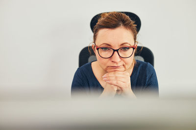 Woman entrepreneur focused on solving difficult work. confused businesswoman thinking hard in office