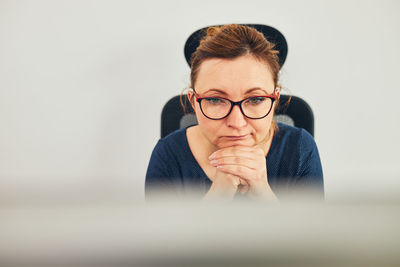 Woman entrepreneur focused on solving difficult work. confused woman thinking hard looking at screen