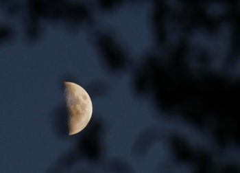 Low angle view of moon against sky at night