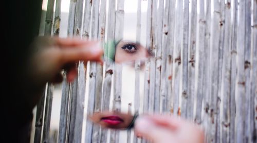 Reflection of woman on broken mirror