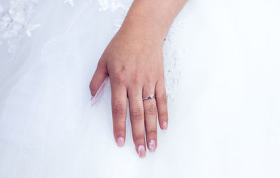 Close-up of bride wearing ring
