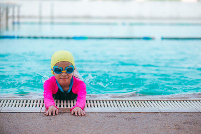 Portrait of boy swimming in pool