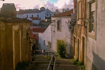 Narrow street amidst buildings in town