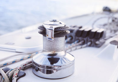 High angle view of coin-operated binoculars against sea