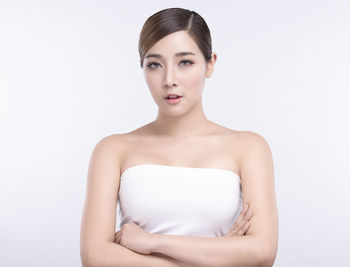 Portrait of a beautiful young woman over white background