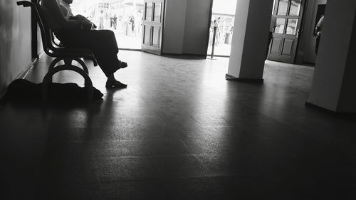 Midsection of man in corridor