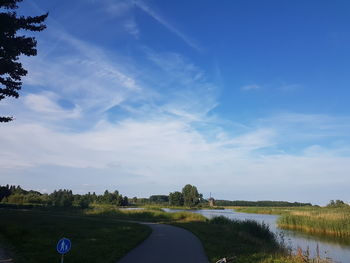 Scenic view of grass against sky