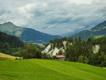 Scenic view of landscape and mountains against sky