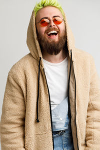 Portrait of smiling man against white background