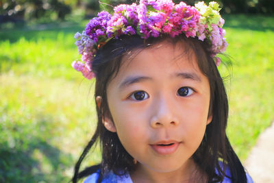 Close-up portrait of young woman in park