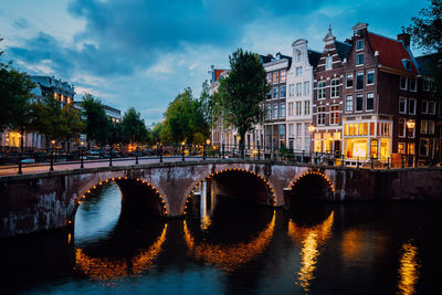 Night city view of amsterdam canal herengracht