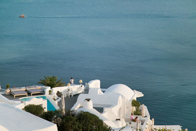 High angle view of town by sea