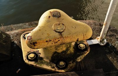 High angle view of old rusty bollard