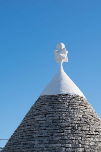 Low angle view of building against blue sky