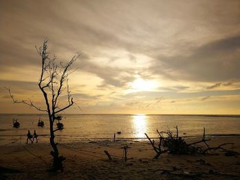 Scenic view of sea against sky at sunset