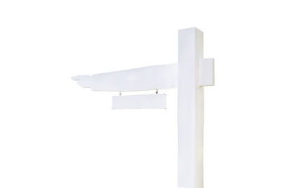 Low angle view of cross against white background