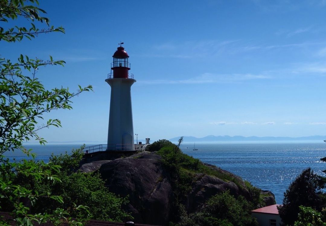 LIGHTHOUSE AGAINST CLEAR BLUE SKY