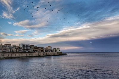 Scenic view of sea against sky during sunset. ortigia island, siracusa, italy