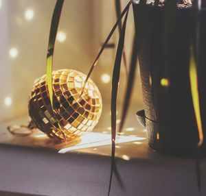 Close-up of illuminated lighting equipment on table